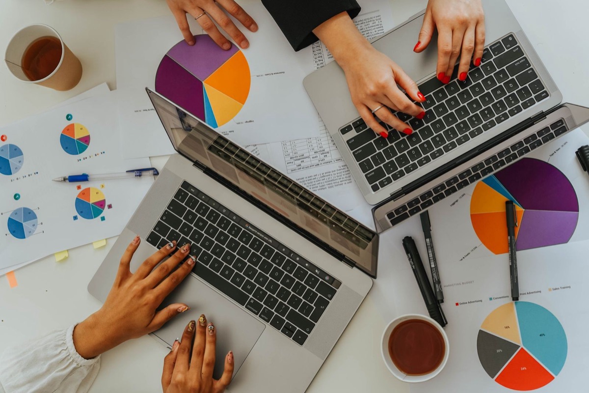 Comparing proxy services: laptops with tables and charts on a desk